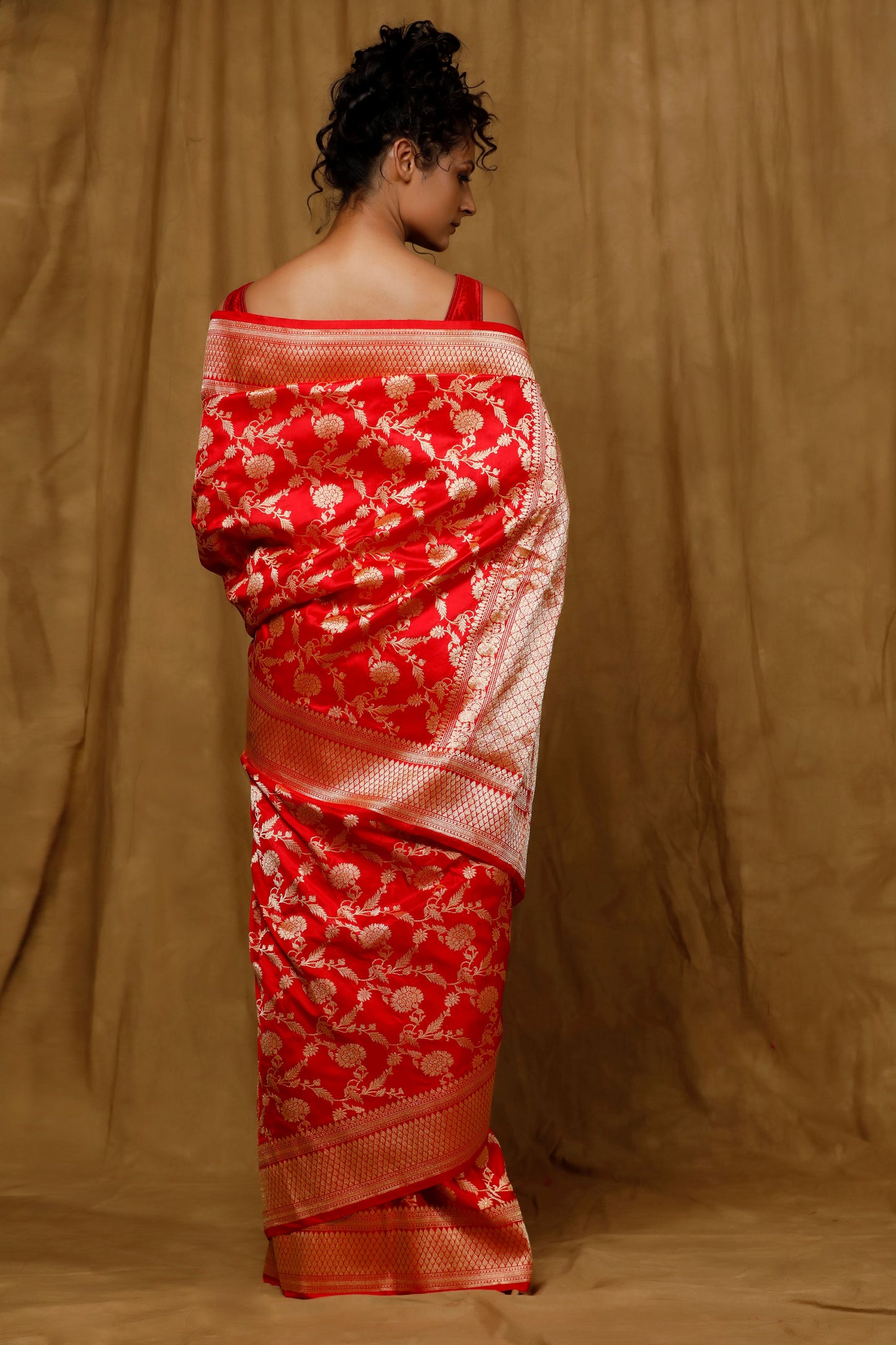 Red Banarasi saree features intricate kadhua jaal